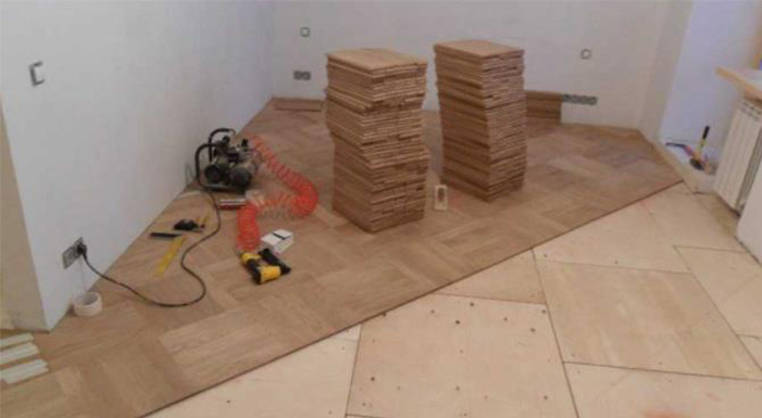 Hardwood flooring installation plywood laying