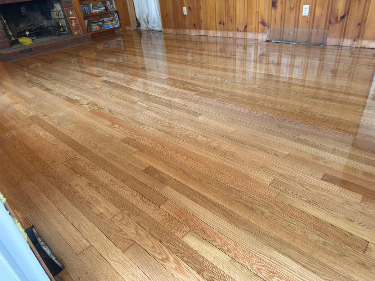 Light wood-colored hardwood installation with a narrow bar